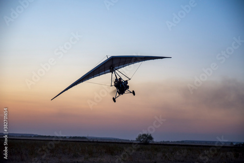 Glider flights at sunset. Evening shooting.