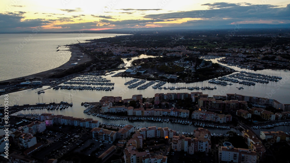 Aerial view of the Cap d'Agde sea resort on the South of France at sunset - Marina along the Mediterranean Sea