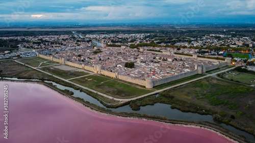 Aerial view of Aigues Mortes, a medieval city surrounded with salt marshes in Camargue, south of France - Fortified town center near the Mediterranean Sea