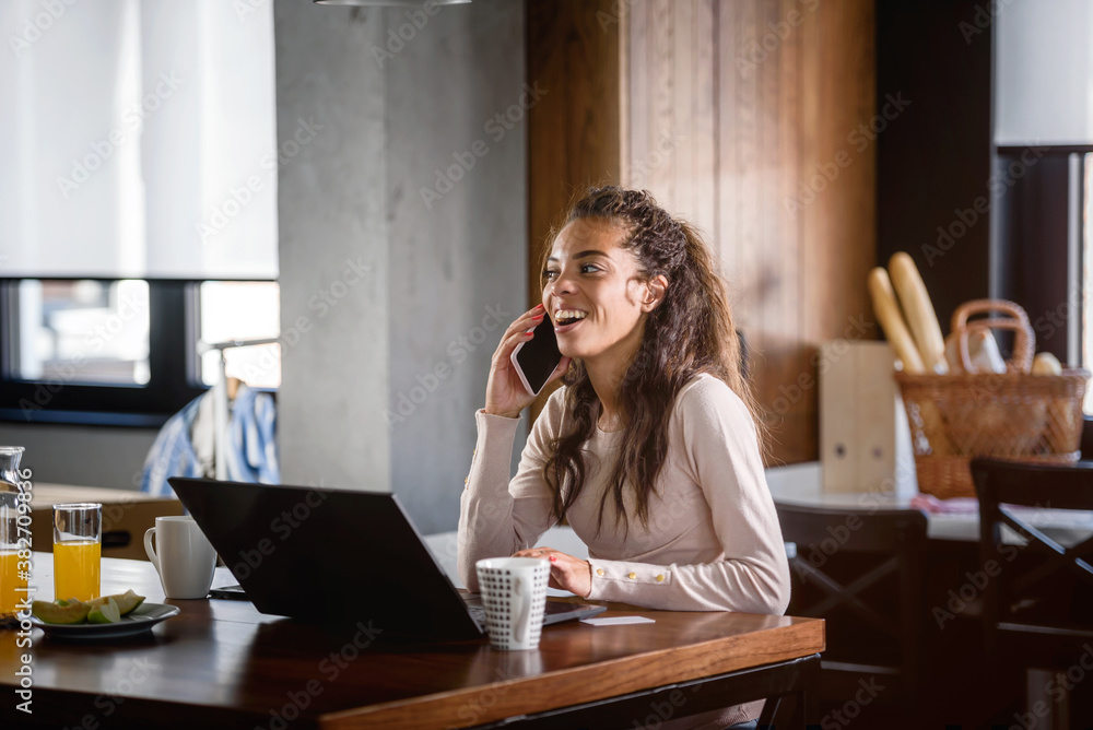 Young business woman working from home, sitting in front of laptop computer having meeting over internet. Woman freelance entrepreneur. Young business woman working from home, sitting in front of laptop computer having meeting over internet. Woman freelance entrepreneur.