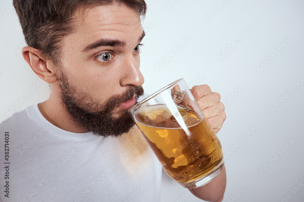 emotional man with a large mug of beer alcoholic drink gesturing with his hands drunken state emotional man with a large mug of beer alcoholic drink gesturing with his hands drunken state