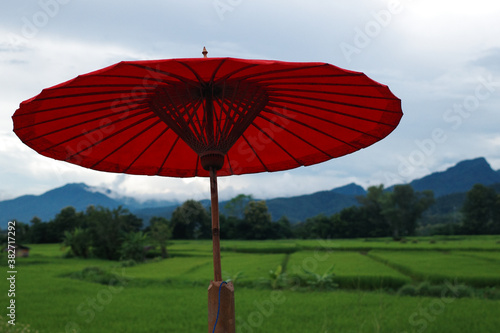 focus on vintage red umbrella decorated in the local coffee shop at Nan province  Thailand