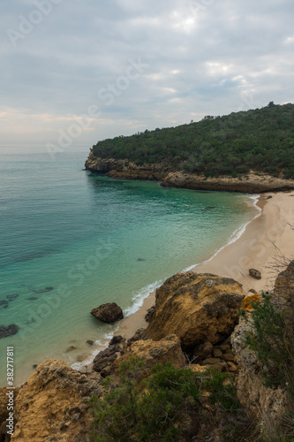 Paradise idylic Coelhos beach with turquoise water in Arrabida park, in Portugal