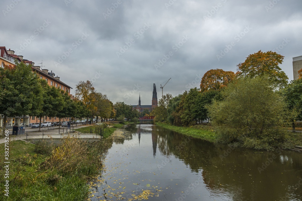 Gorgeous view on town street with cathedral on background in autumn day. Tourism, travel concept. Europe, Sweden, Uppsala.
