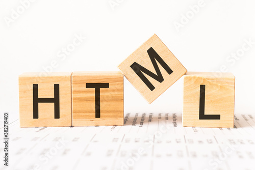 Word html. Wooden small cubes with letters isolated on white background with copy space available.Business Concept image.