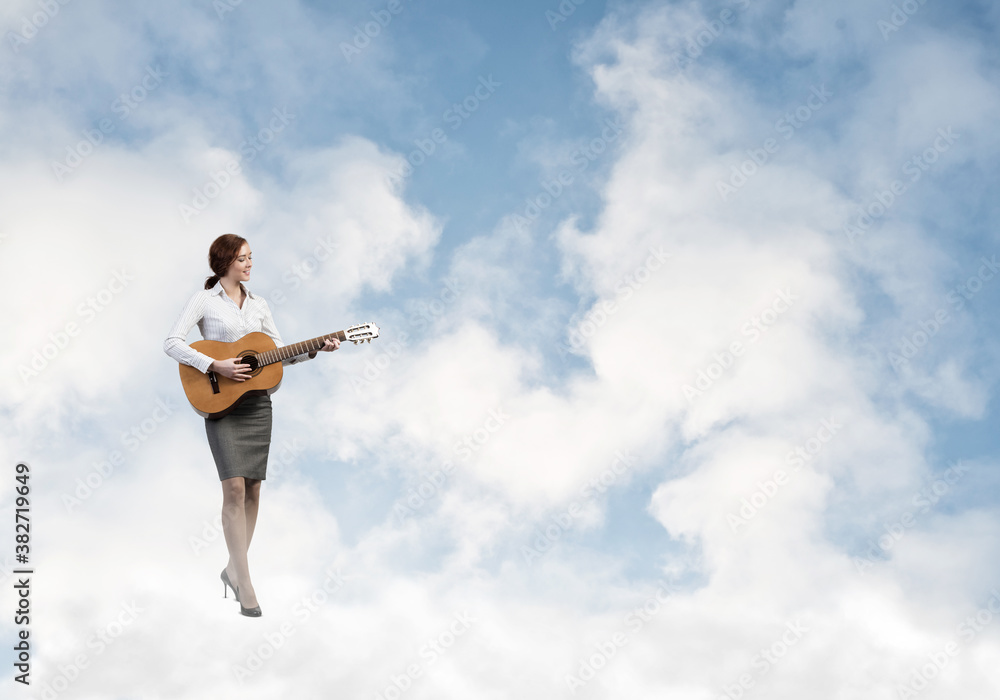 Businesswoman play guitar