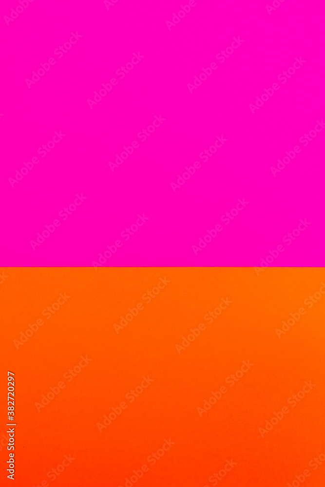 Pink and orange paper background. Color match. Festive and tropical juicy colorful backdrop