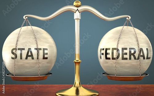 state and federal staying in balance - pictured as a metal scale with weights and labels state and federal to symbolize balance and symmetry of those concepts, 3d illustration photo