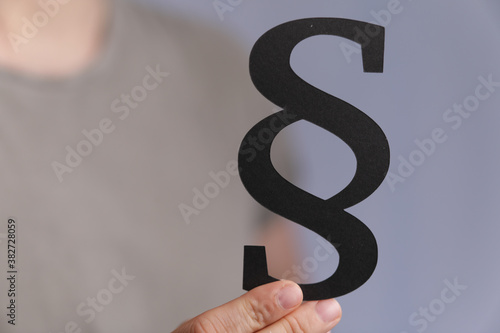 Photos paragraph law sign digital in hand black.