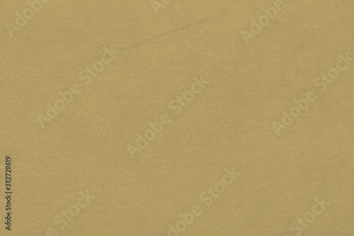 Vintage and old looking paper background. Colored gold with a brown retro book cover. Ancient book page. photo