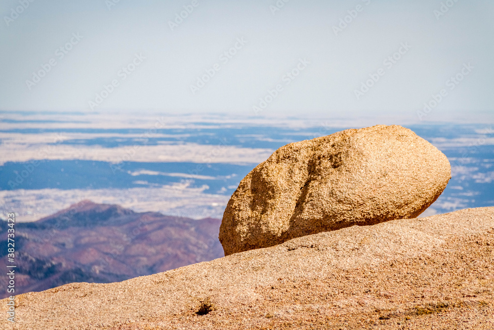 rock on mountain top with view