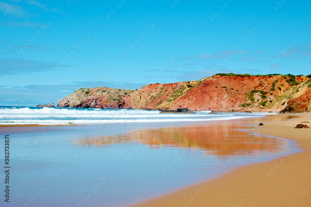 Rocky coast, surfing beach Praia do Amado near Carrapateira, Algarve, Portugal.