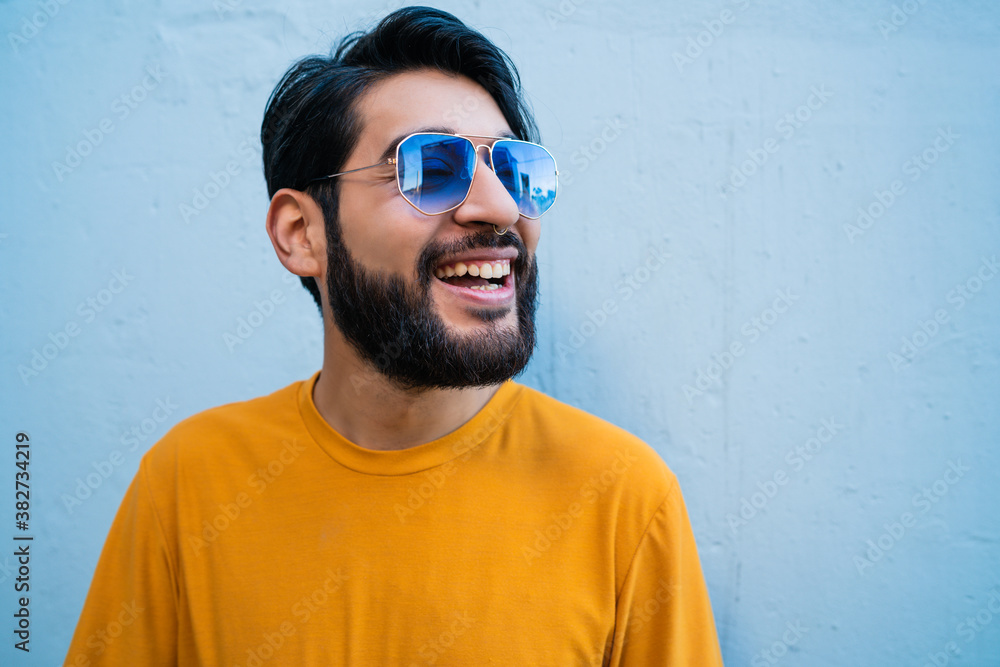 Man wearing summer clothes and sunglasses. Man wearing summer clothes and sunglasses.