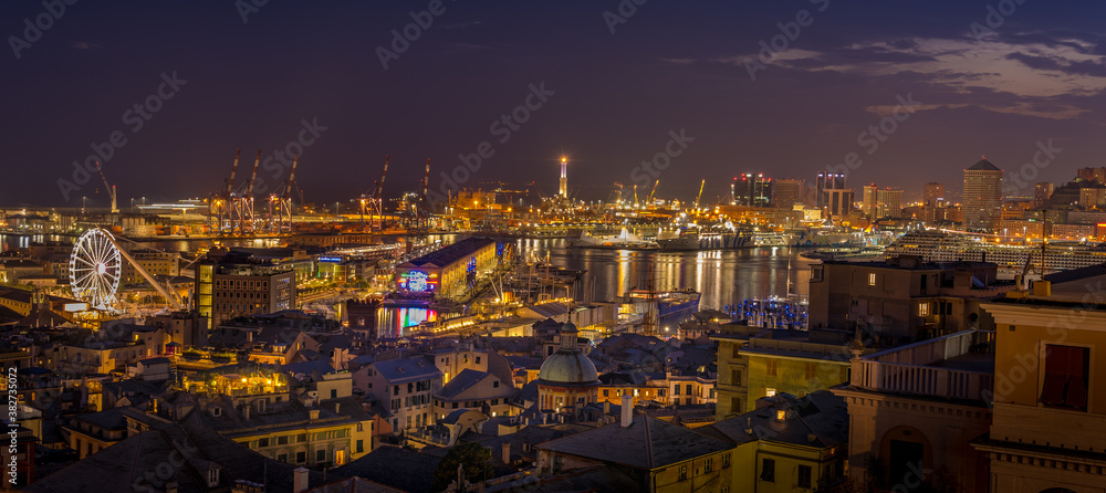 Genoa, Italy - 09 19 2020: Genoa harbor from Spianata Castelletto by night. 