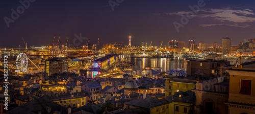Genoa, Italy - 09 19 2020: Genoa harbor from Spianata Castelletto by night. © maramade