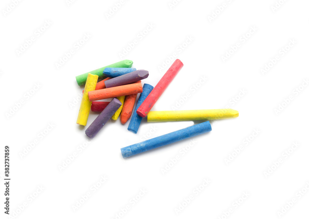chalks in a variety of colors arranged on a white background chalks in a variety of colors arranged on a white background