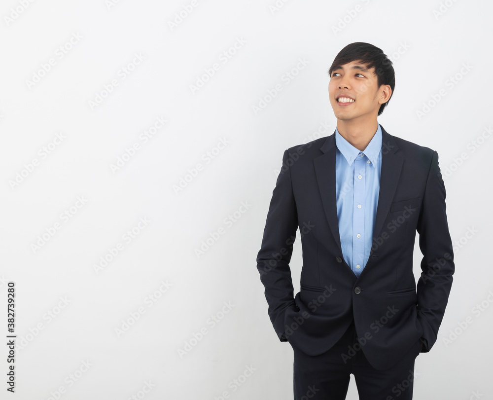 Young handsome asian business man thinking an idea while looking up isolated on white background. Young handsome asian business man thinking an idea while looking up isolated on white background.