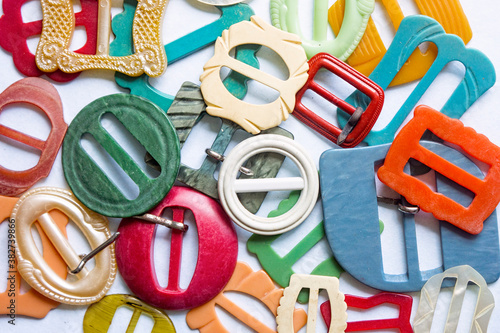 Collection of colorful retro vintage belt buckles. photo