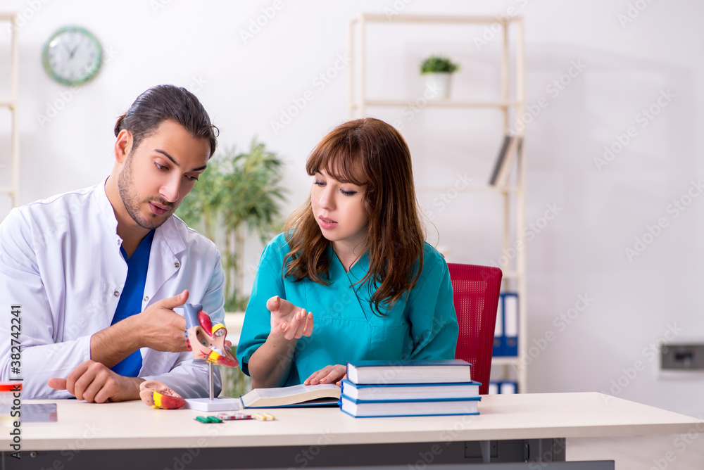Two doctors colleagues working in the hospital Two doctors colleagues working in the hospital