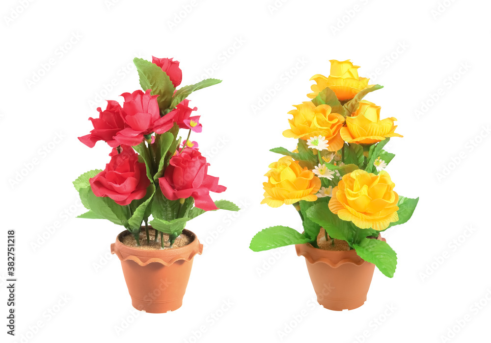 The artificial flower red and yellow in the pot isolated on white background with clipping path The artificial flower red and yellow in the pot isolated on white background with clipping path