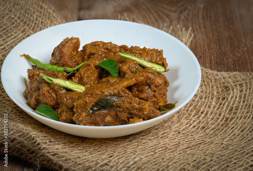 Spicy chicken roast or curry - Kerala style