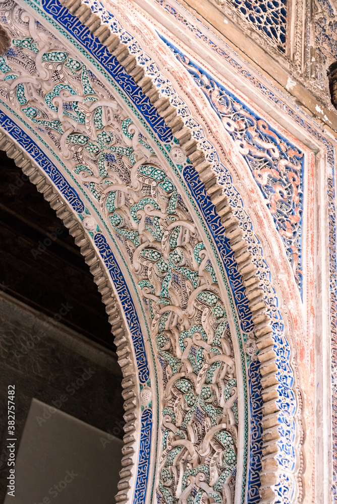 the ornament for a king.
view of the decoration on the wall of the royal palace (alcazar) in seville. spain.