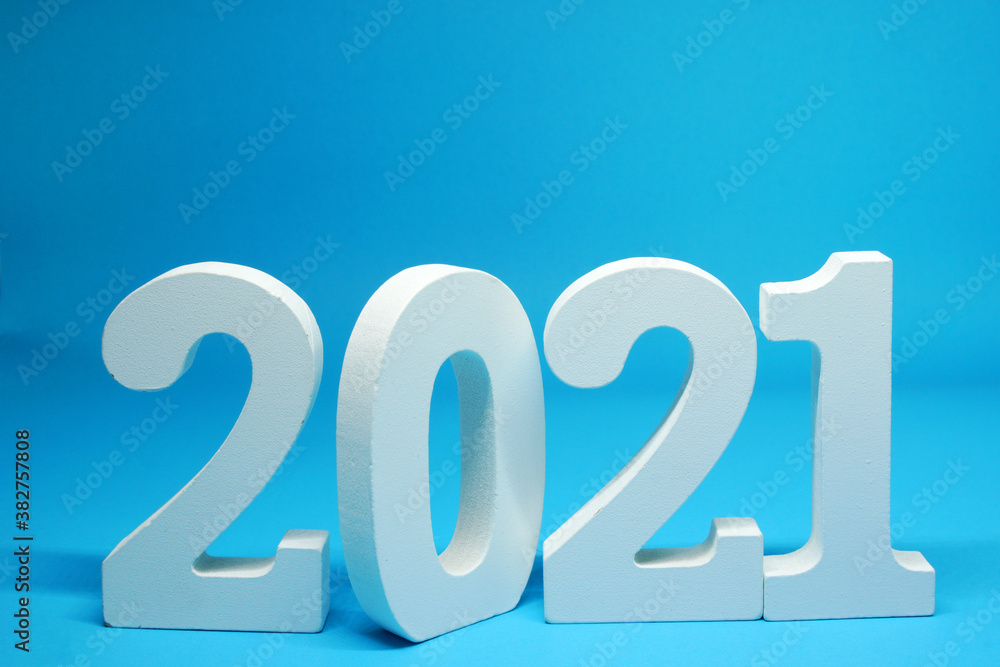 2021 number wooden object on Blue background and copy space - Happy new year 2021 - Blue new year celebrate concept - Countdown from 2020 to 2021 2021 number wooden object on Blue background and copy space - Happy new year 2021 - Blue new year celebrate concept - Countdown from 2020 to 2021