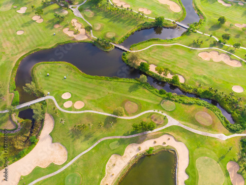 Aerial view green grass golf course field with river