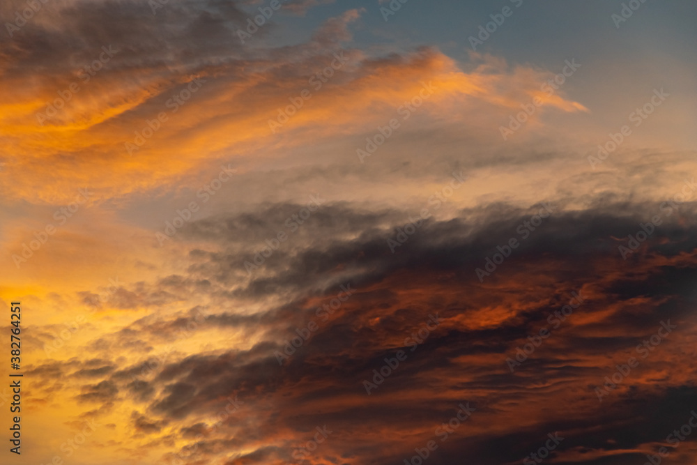 warm coloured contrasting clouds during a morning sunrise background