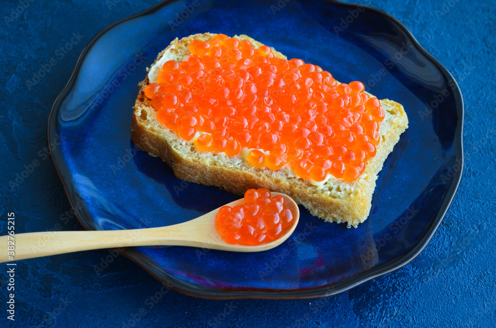 Sandwich with red salmon caviar. Healthy and satisfying natural food Sandwich with red salmon caviar. Healthy and satisfying natural food