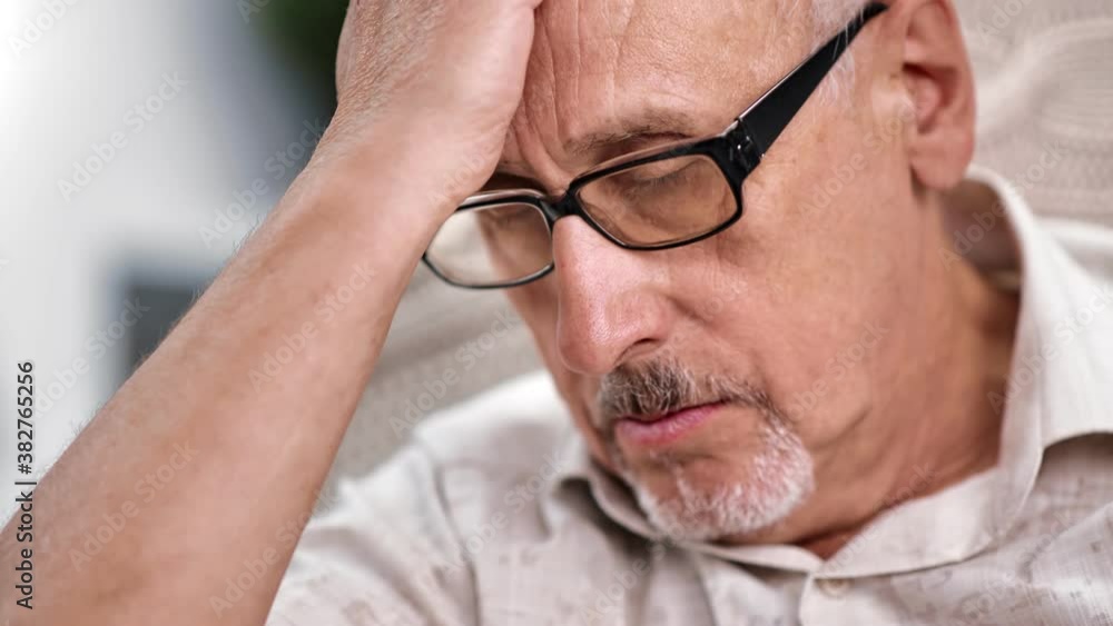 Closeup sad mature 70s grandfather worried about health problem. Shot on RED Raven 4k Cinema Camera Closeup sad mature 70s grandfather worried about health problem. Shot on RED Raven 4k Cinema Camera