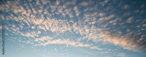 Beautiful landscape image of colorful vibrant mackerel sky cloud formation in late Summer