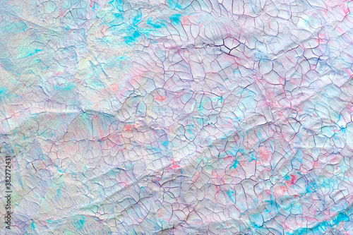 Cracked paint, blues and pinks, craquelures. Painted old background