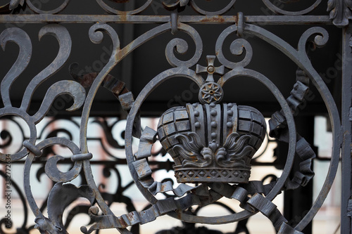 Crown on a wrought iron fence, entrance to the courtyard