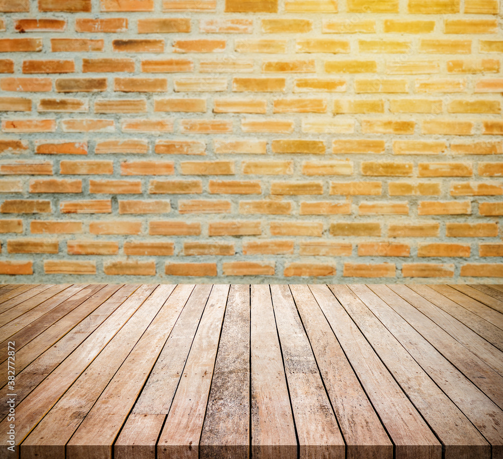 Old wood table with abstract old brick wall background for product display