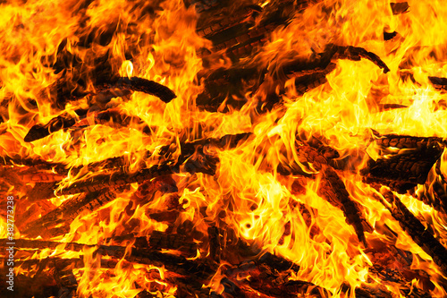 Flame fire background, blaze texture. Burning wood