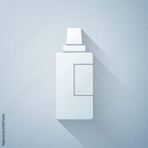 Paper cut Plastic bottle for laundry detergent, bleach, dishwashing liquid or another cleaning agent icon isolated on grey background. Paper art style. Vector.