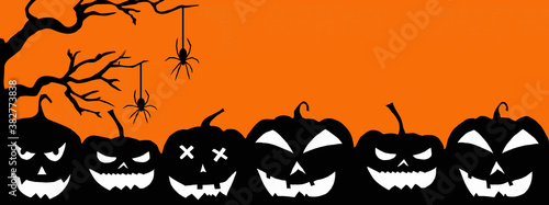 HALLOWEEN background banner template -Silhouette of scary carved luminous cartoon pumpkins, trees and spiders isolated on dark orange night texture