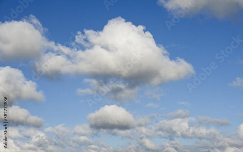 White clouds cumulus floating on blue sky for backgrounds concept