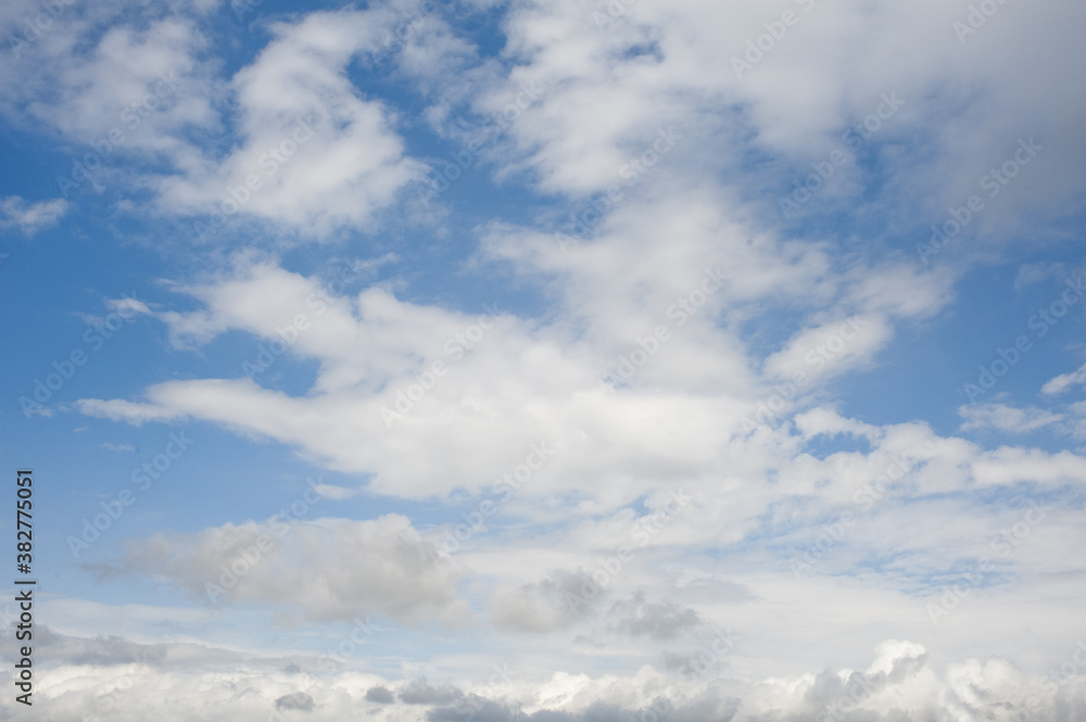 White clouds cumulus floating on blue sky for backgrounds concept