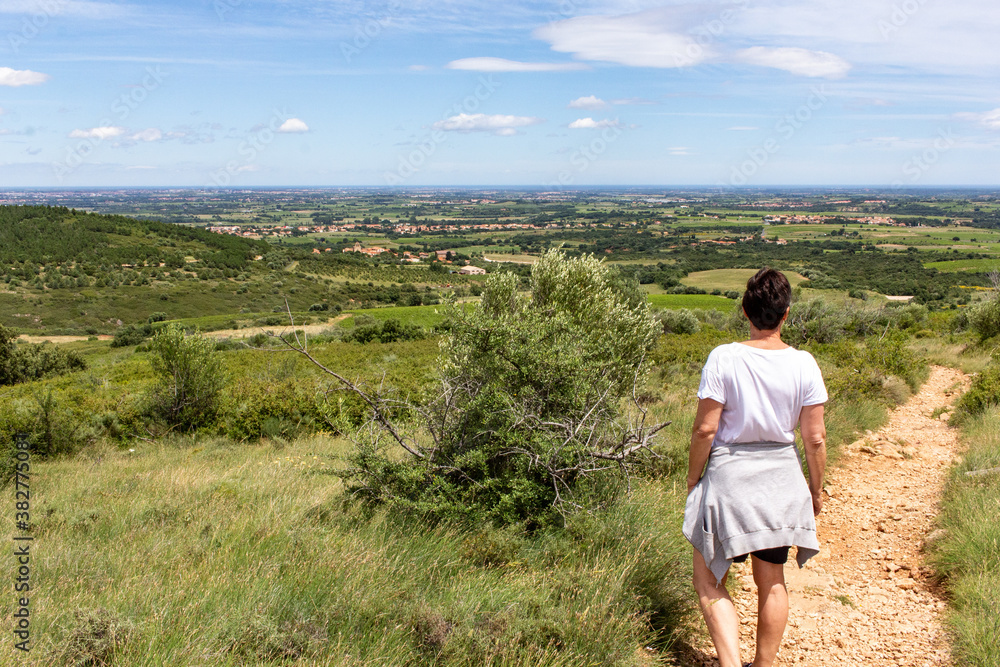 walker woman contemplating the Roussillon plain