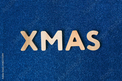 Merry Christmas greeting card, frame, banner. New Year. Xmas text on shiny blue background. Winter holiday christmas concept