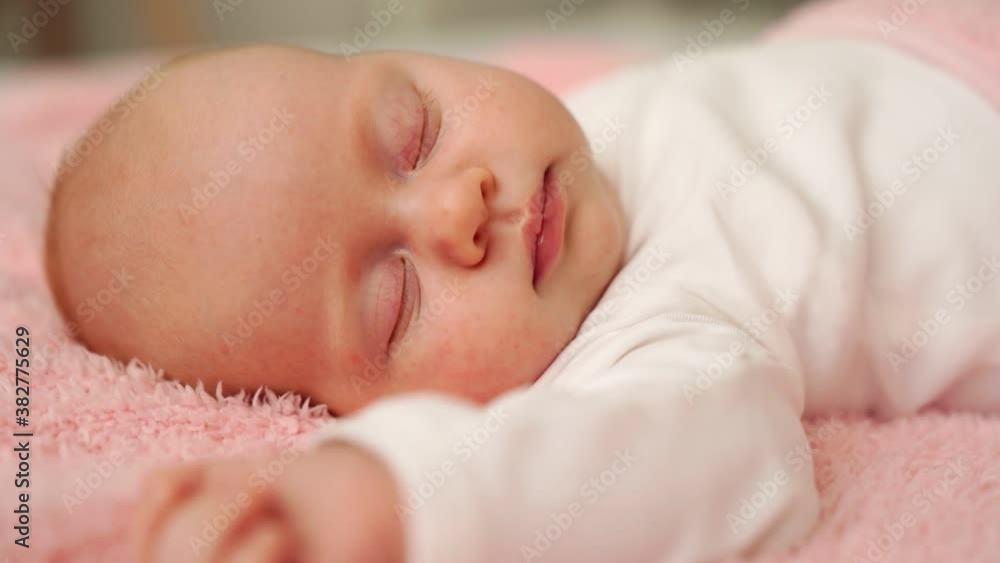 sleeping baby under pink blanket. mode of day, healthy sleep in newborns sleeping baby under pink blanket. mode of day, healthy sleep in newborns