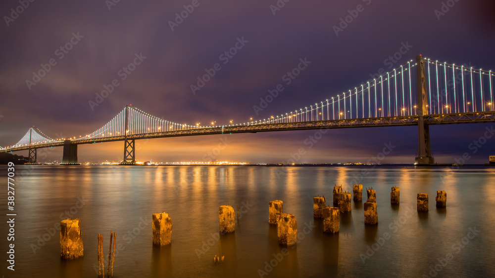 Panoramic view of San Francisco Bay bridge at night, California, United States