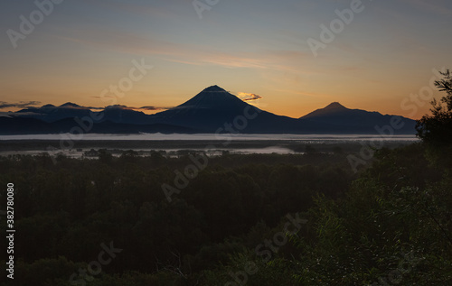 Kamchatka, a group of volcanoes at sunset