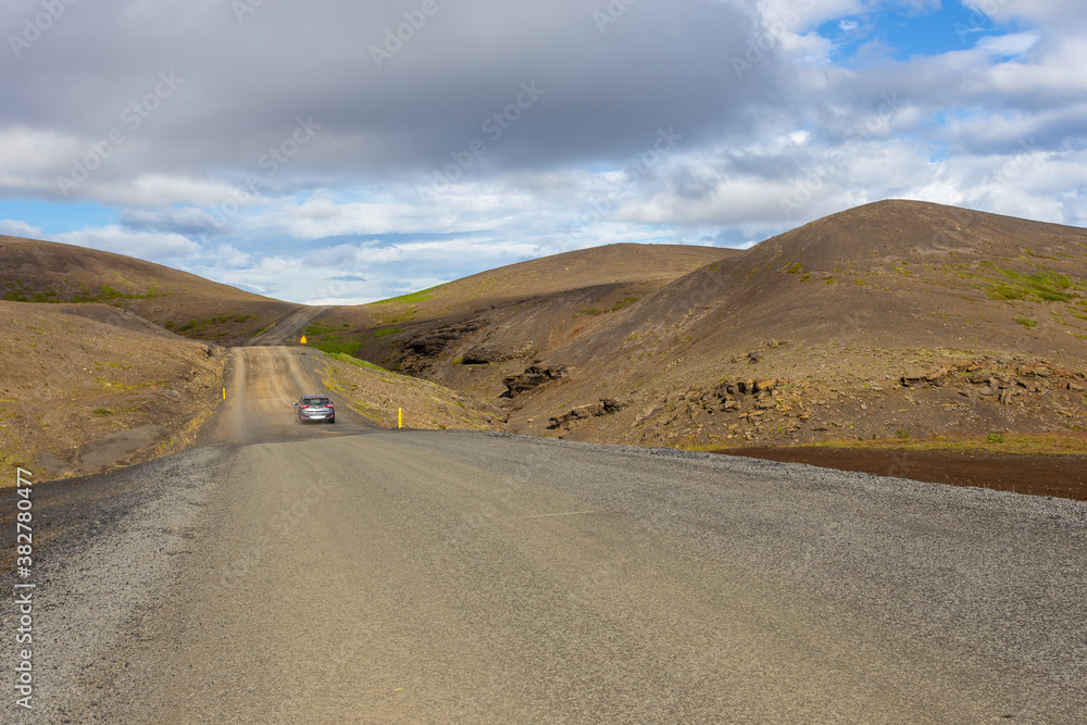 Typical Icelandic landscape with asphalt road, Iceland.