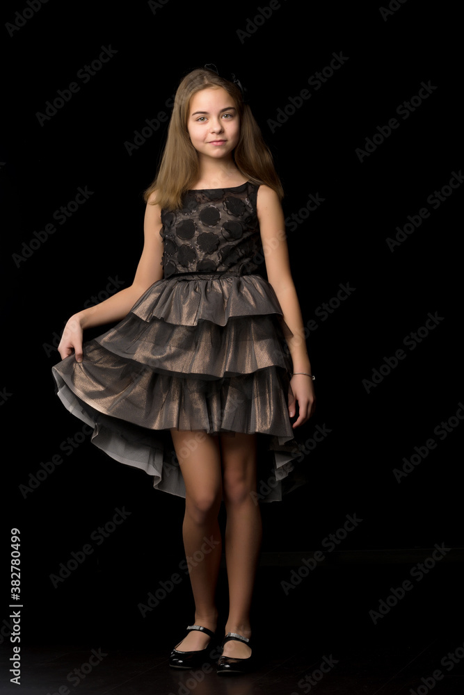 Beautiful young teen girl studio photo on black background Beautiful young teen girl studio photo on black background