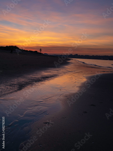 Sunset on the beach of the bay in Santander