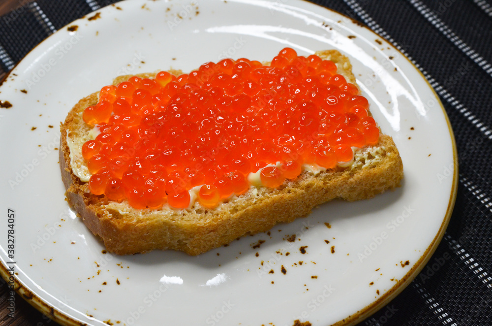 Sandwich with red salmon caviar. Healthy and satisfying natural food Sandwich with red salmon caviar. Healthy and satisfying natural food