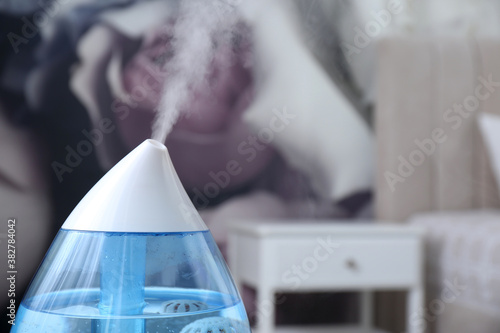 Modern air humidifier indoors  closeup. Space for text